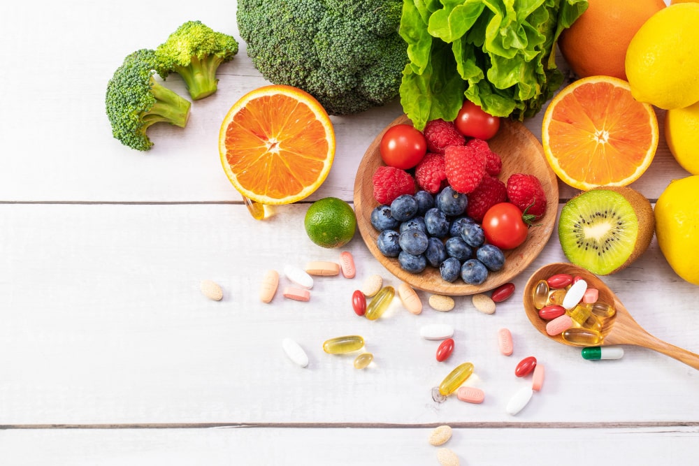 top-view-fresh-fruits-vegetables-with-different-medicine-wooden-spoon-min